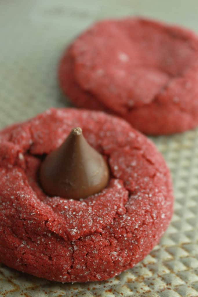 Red Velvet Kiss Cookies Recipe made with a Cake Mix featured by top US cookie blog, Practically Homemade