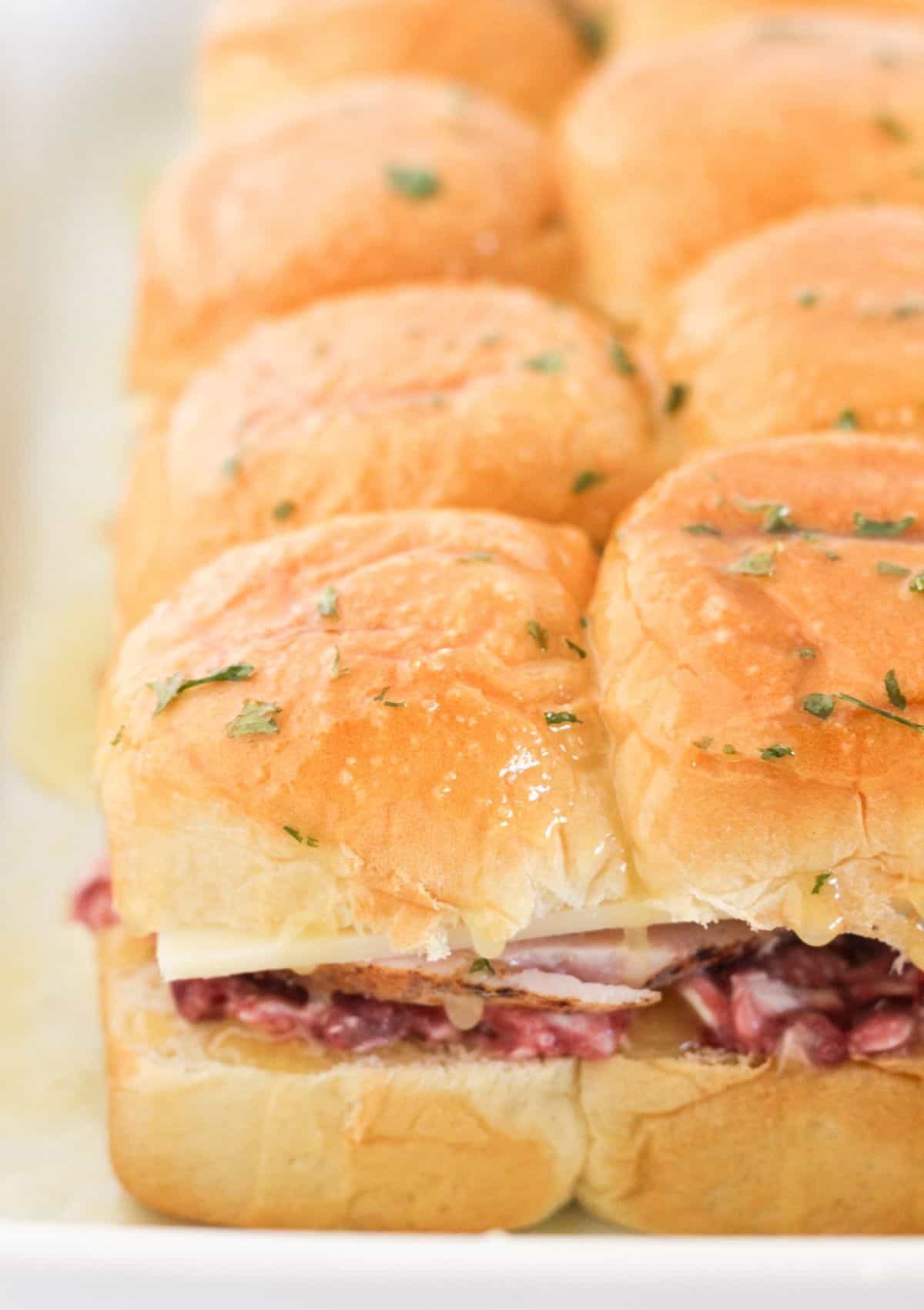 Topping with rolls and butter mixture for baking.