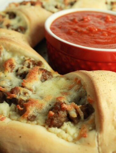 Italian Sausage Ricotta Pizza Ring Recipe featured by top US food blog, Practically Homemade