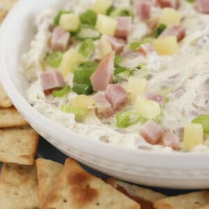 Hawaiian Ham Dip on a tray with crackers.