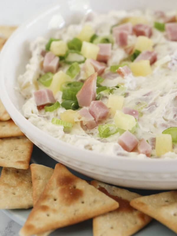 Hawaiian Ham Dip on a tray with crackers.