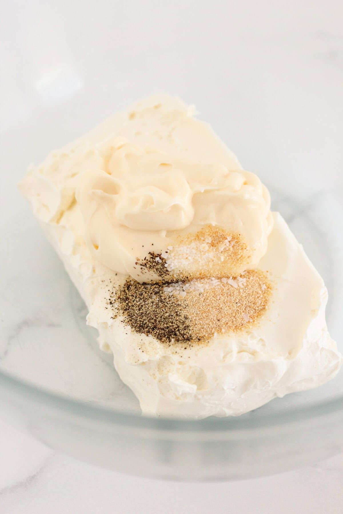 Combining the cream cheese and spices in a medium bowl.