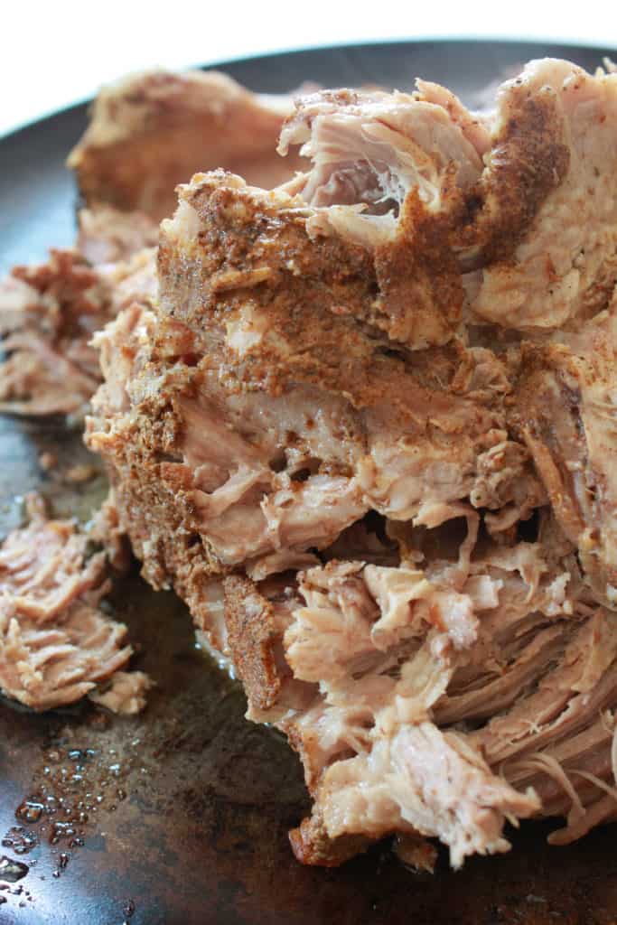 Crock Pot Pulled Pork Recipe featured by top US food blog, Practically Homemade