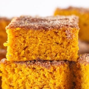Pumpkin Snickerdoodle snack cake cut into squares.