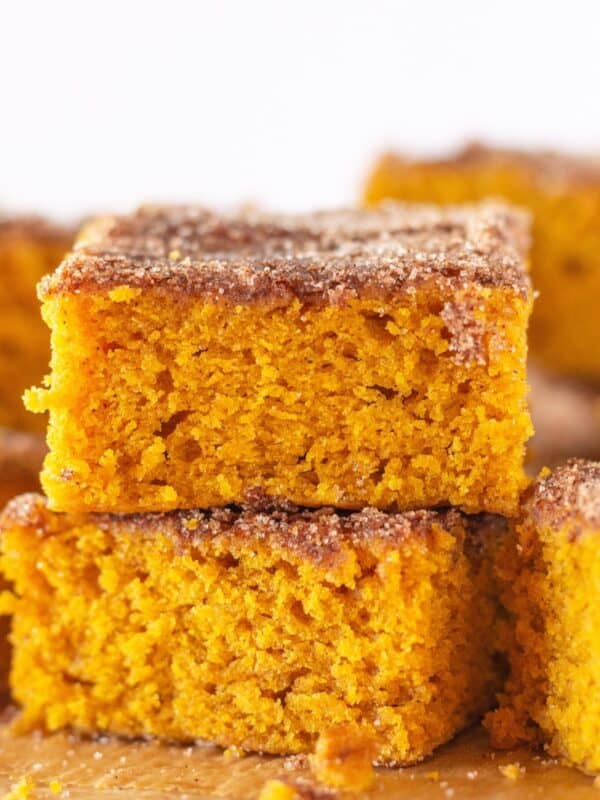 Pumpkin Snickerdoodle snack cake cut into squares.