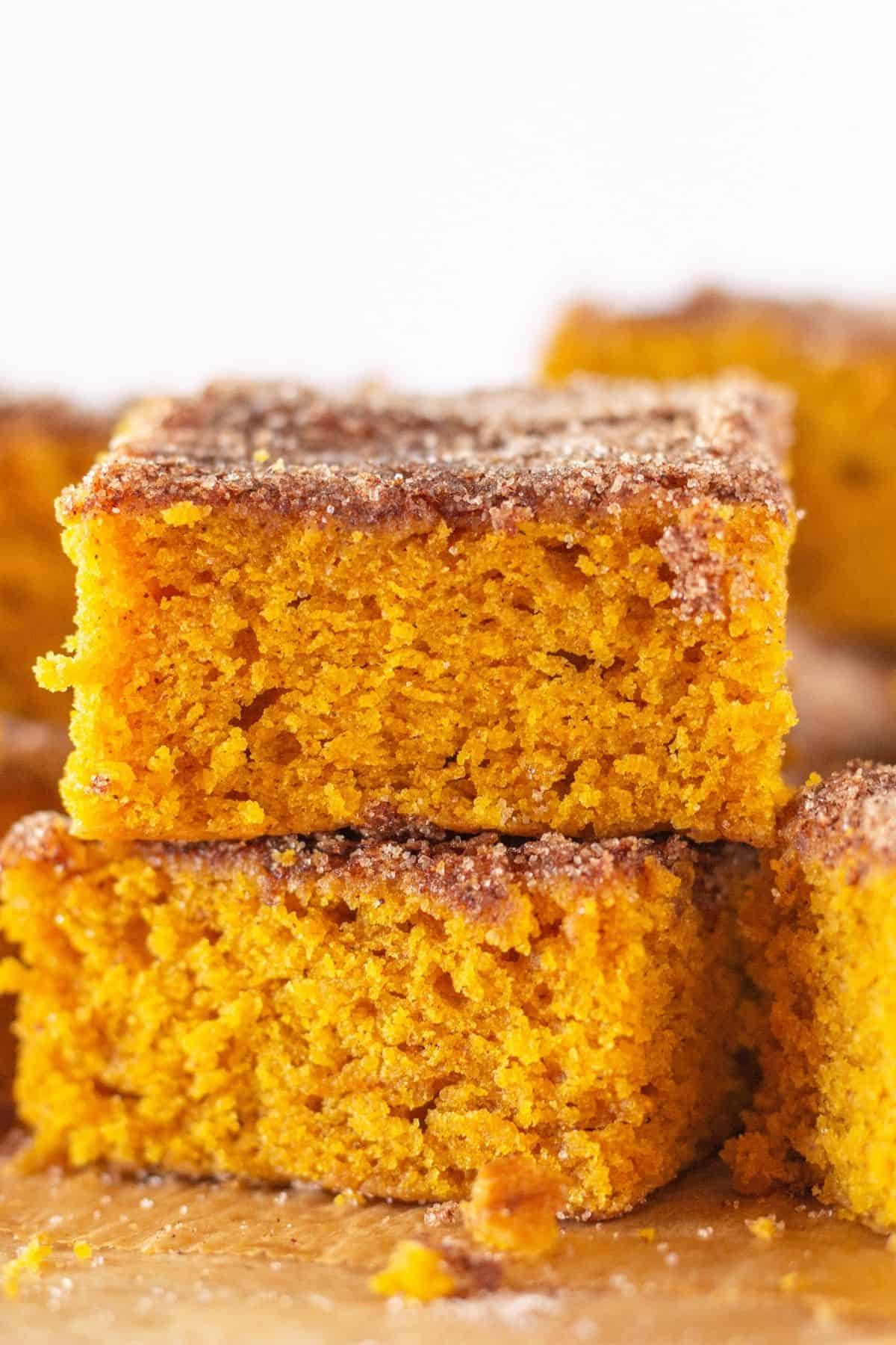 Pumpkin Snickerdoodle snack cake cut into squares.