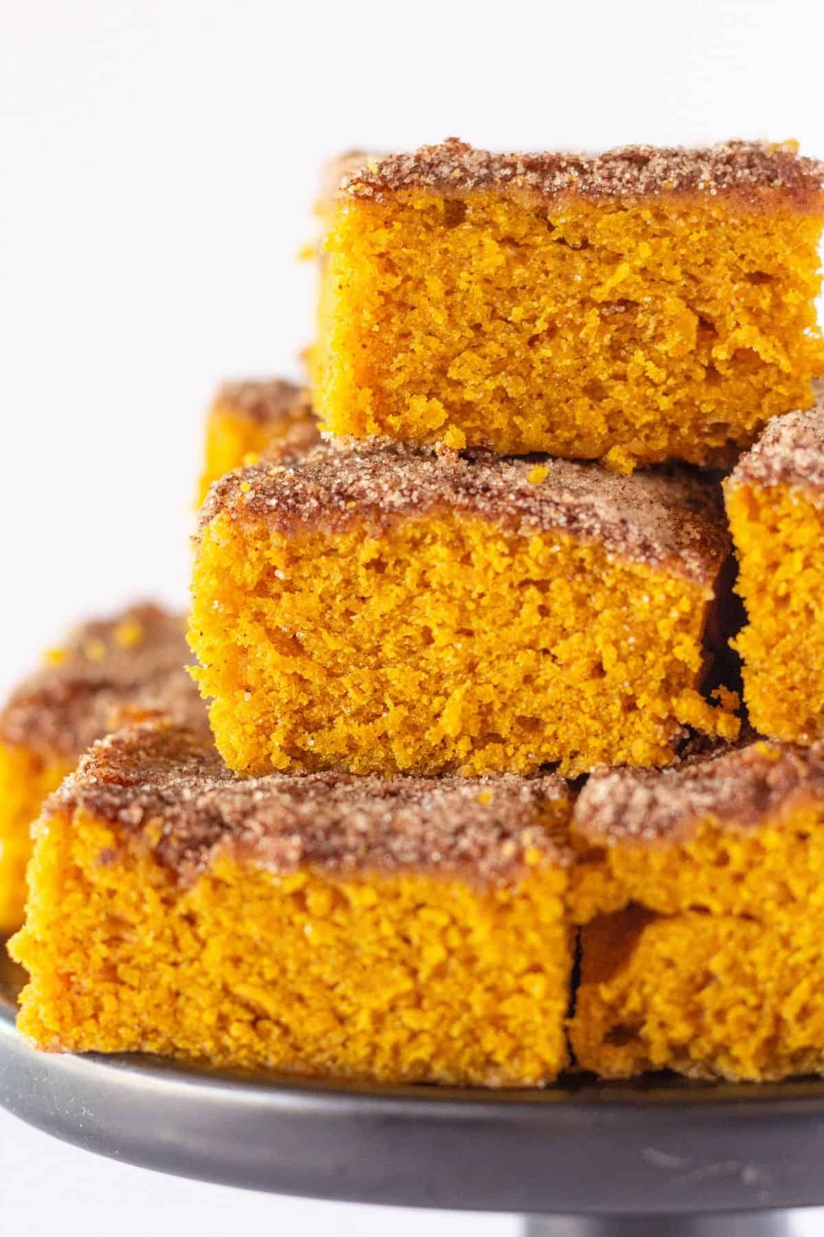 Squares of pumpkin cake with snickerdoodle topping.