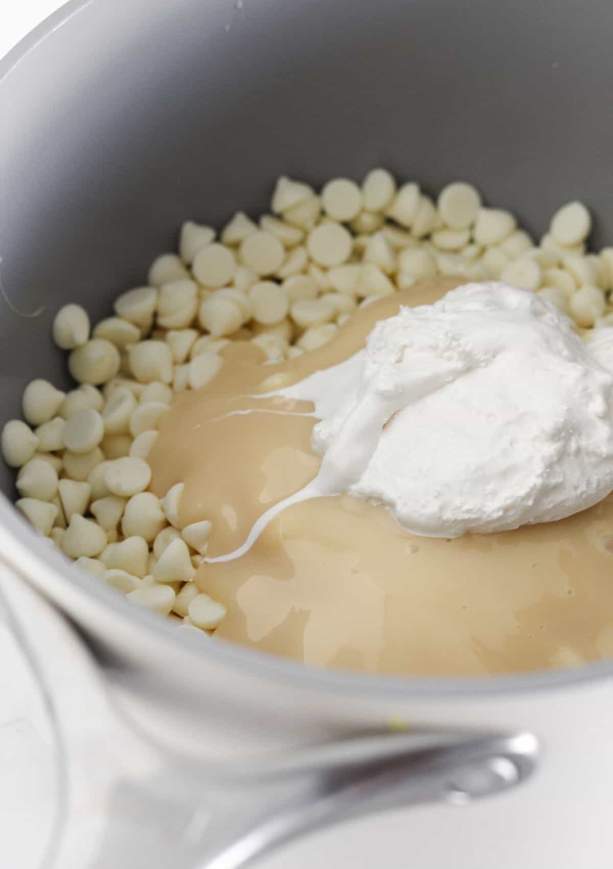 The white chocolate layer ingredients in a sauce pan.