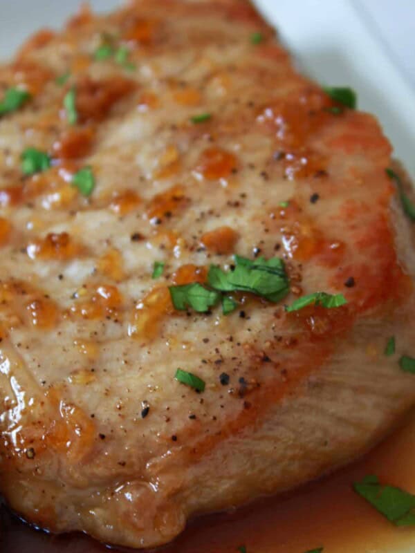 Sweet Asian Glazed Pork Chops Recipe, featured by top US food blog, Practically Homemade