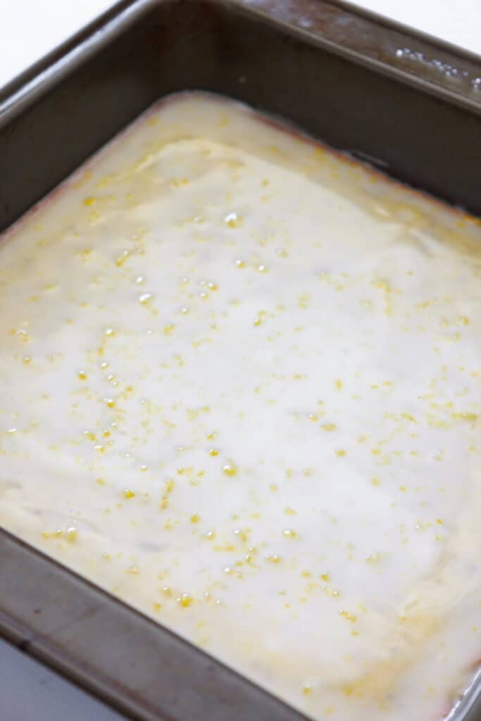 Glazed Lemon Poppy Seed Bars Recipe featured by top US food blog, Practically Homemade