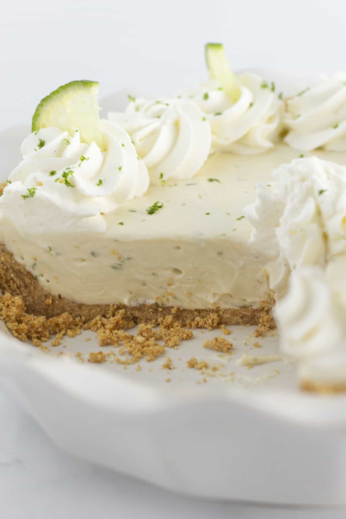 Showing the inside of a key lime pie with graham cracker crust.