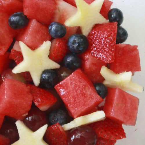 A bowl full of fourth of July fruit salad.