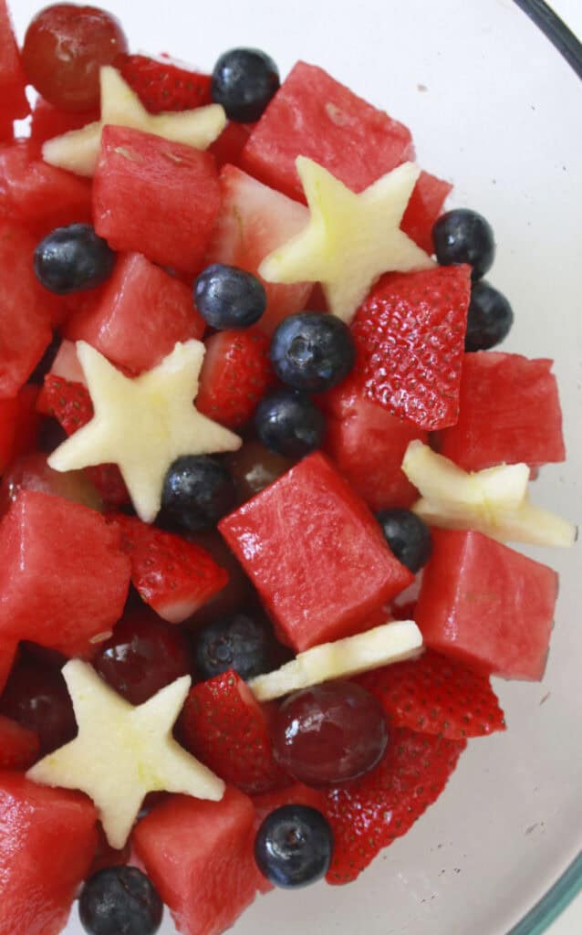 A bowl full of fourth of July fruit salad.