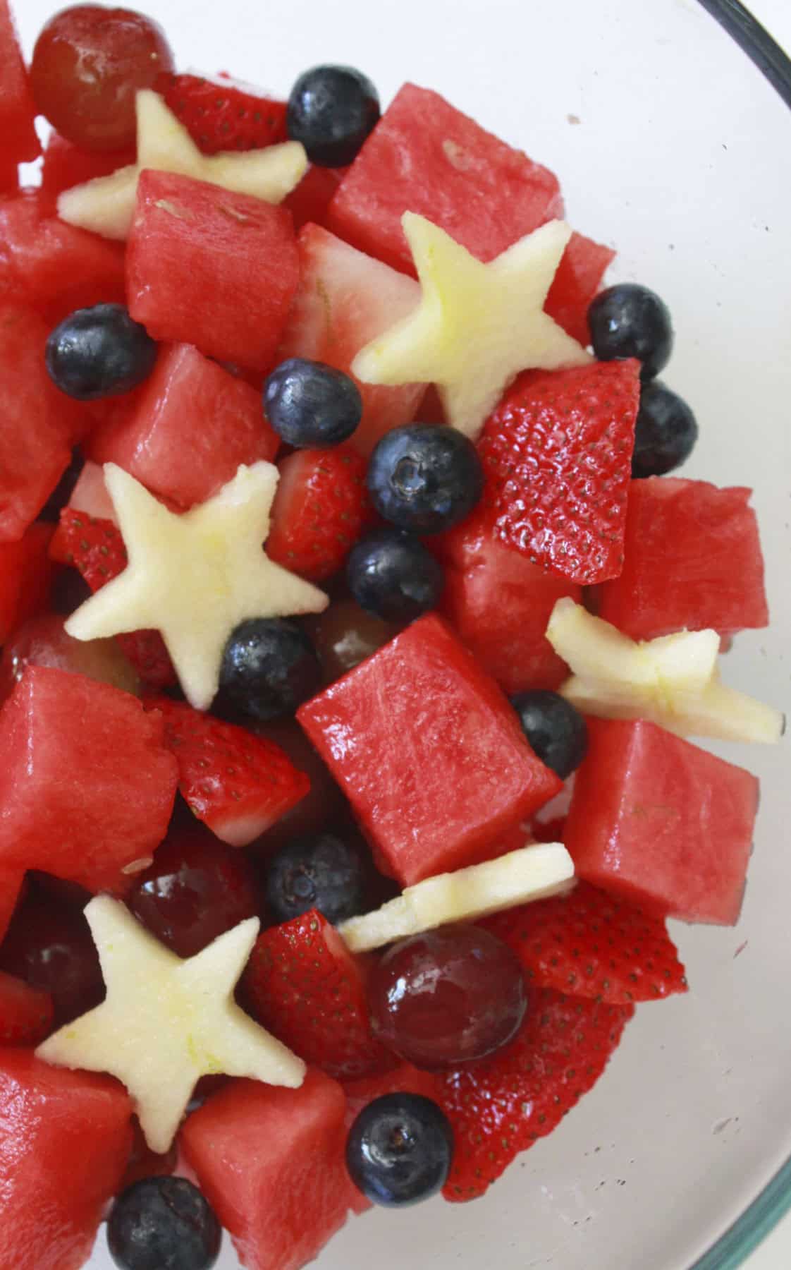 A bowl full of fourth of July fruit salad.
