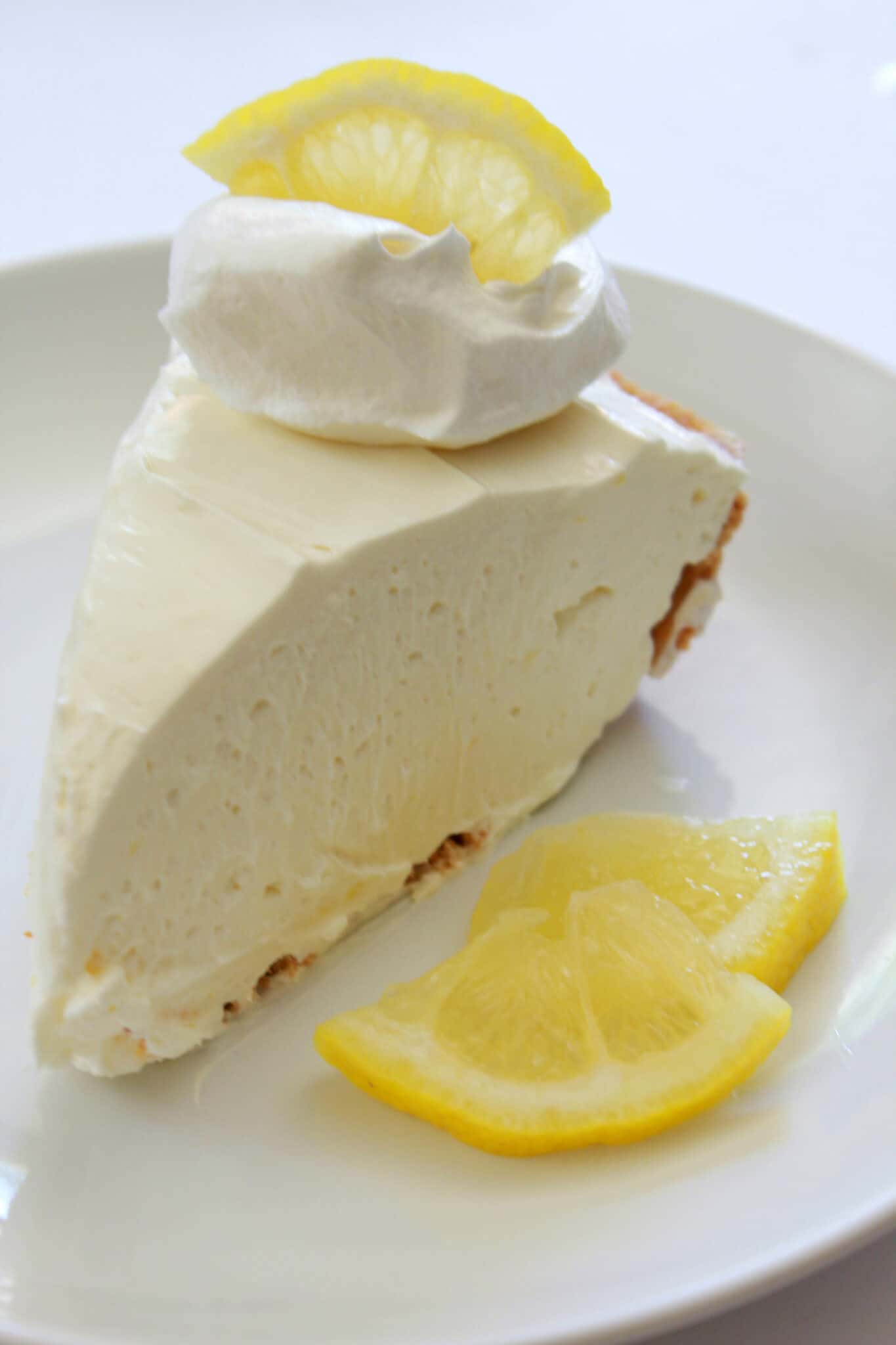Best No Bake Cheesecakes of 2020 featured by top US dessert blogger, Practically Homemade: no bake lemon cheesecake