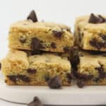 Stacks of chocolate chip cookie bars made with a yellow cake mix.
