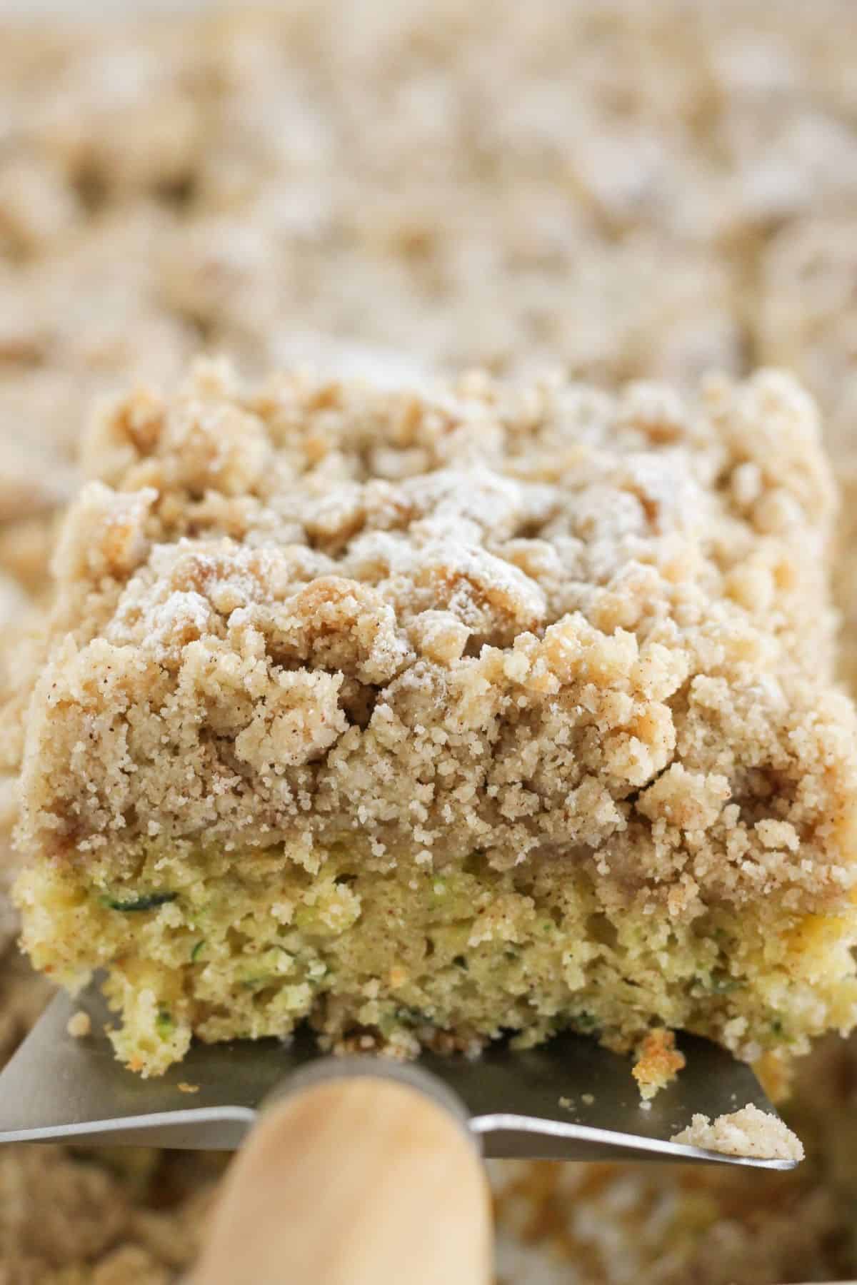 Serving a slice of zucchini coffee cake.