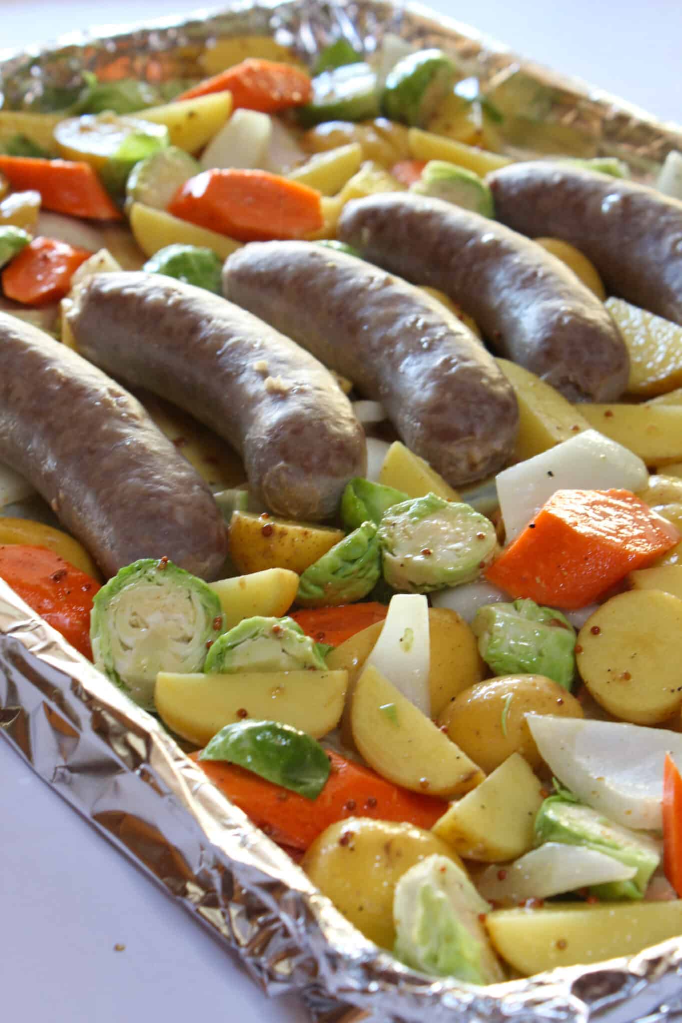 Sheet Pan Brats and Potatoes recipe for Oktoberfest dinner, featured by top US food blog, Practically Homemade