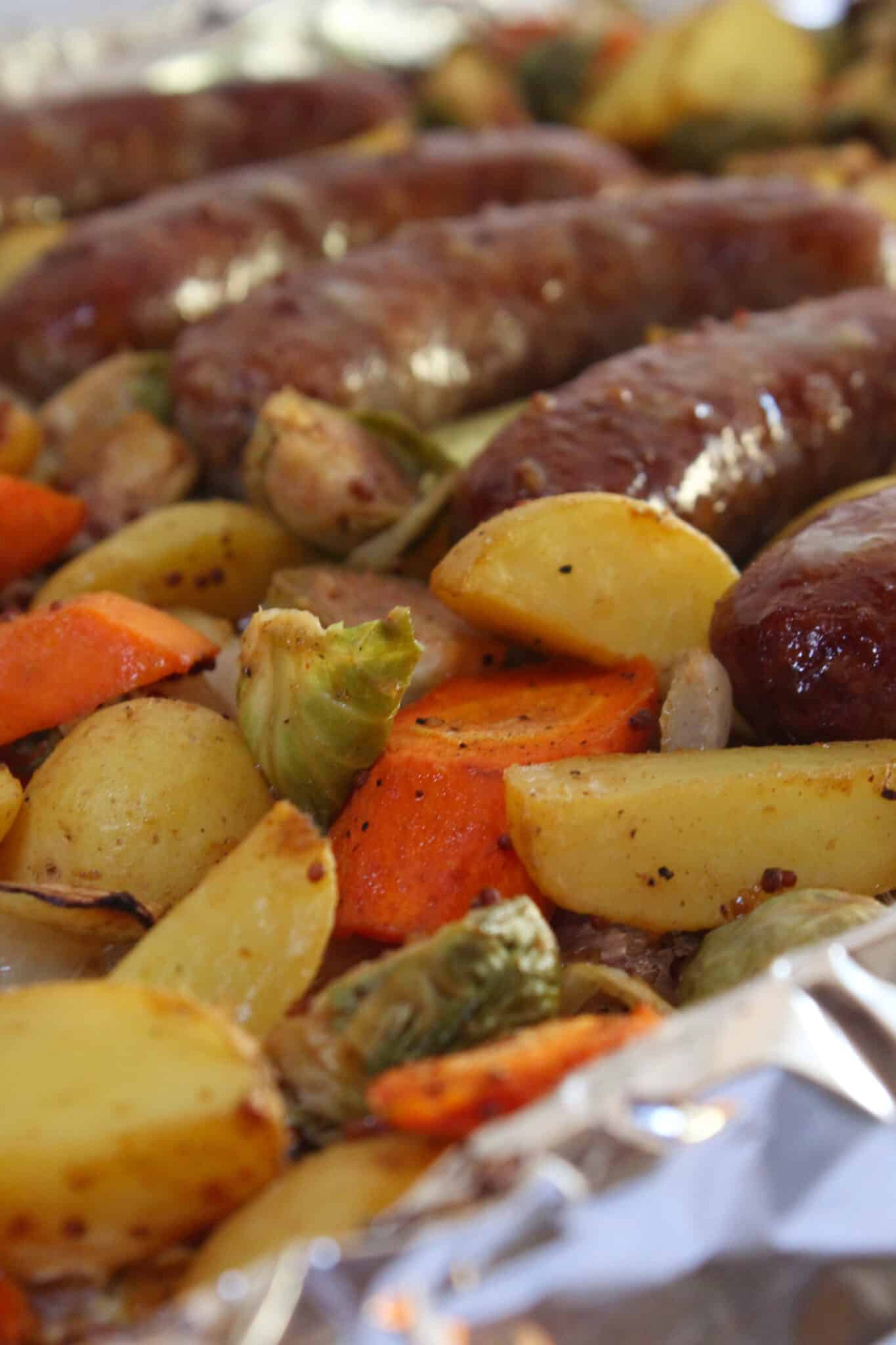 Sheet Pan Brats and Potatoes recipe for Oktoberfest dinner, featured by top US food blog, Practically Homemade