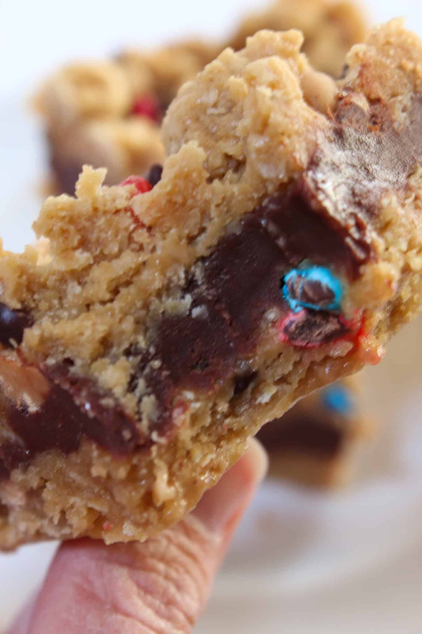 Monster Cookie Oatmeal Fudge Bars Recipe featured by top US food blog, Practically Homemade