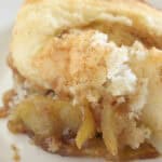 A serving of cake mix apple cobbler on a plate.