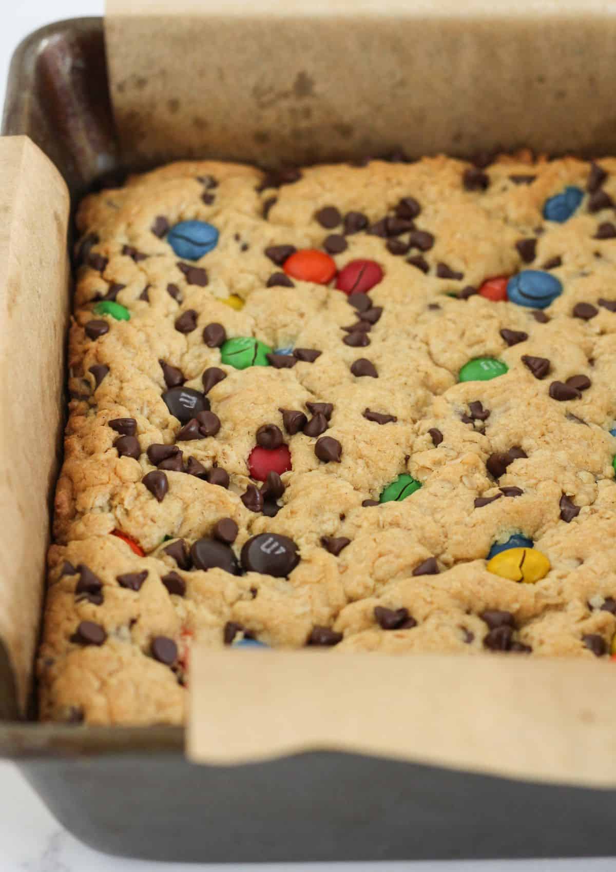 Baked monster cookie bars in the pan.