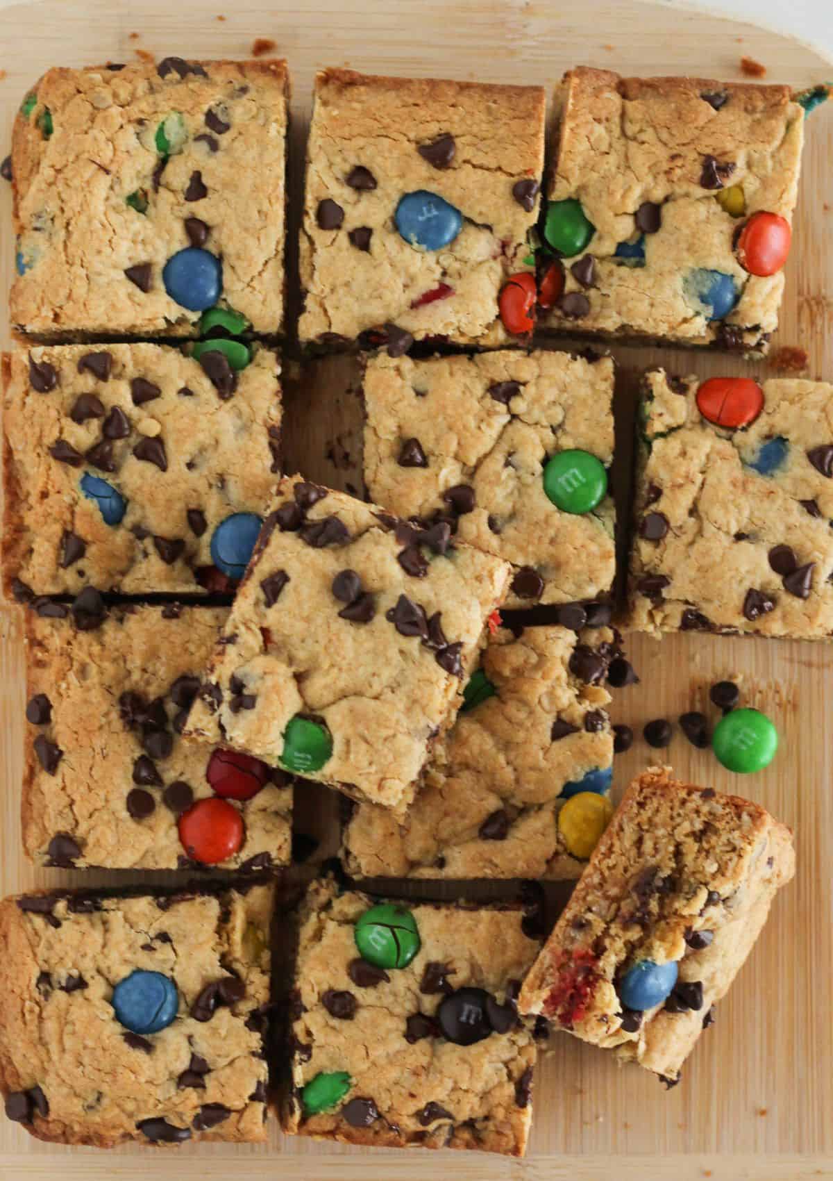 Cooled monster cookie bars cut into squares.