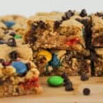 Monster cookie bars stacked on each other for serving.