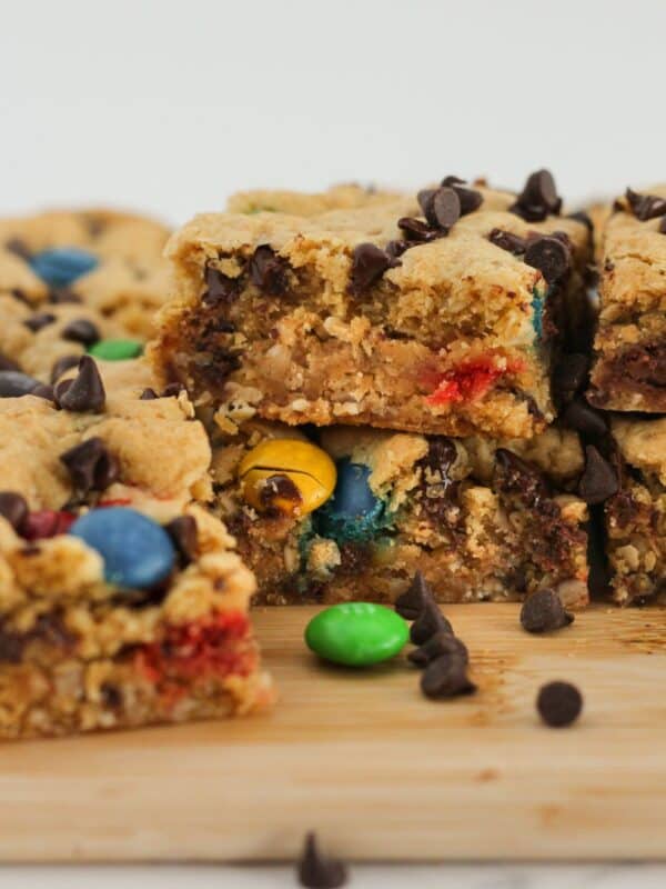 Monster cookie bars stacked on each other for serving.