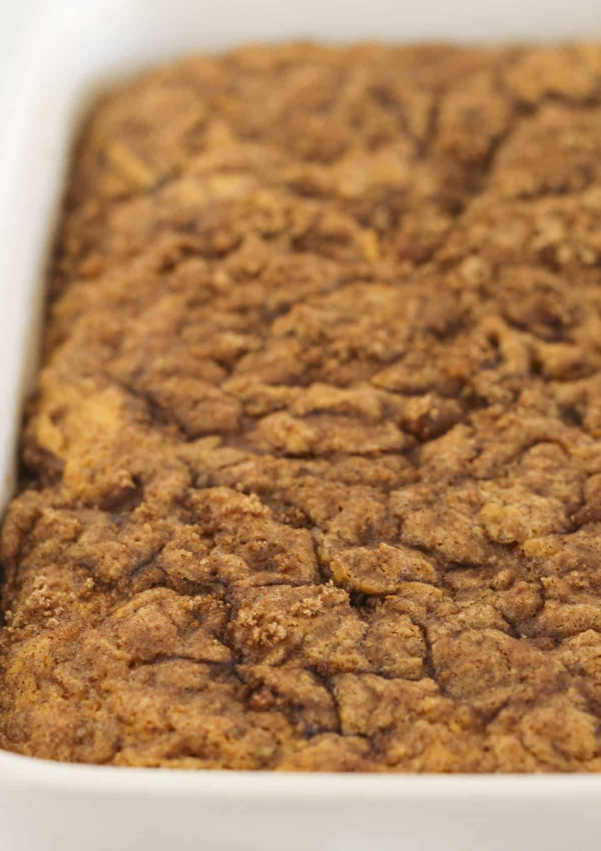 Baking the cinnamon roll cake with pumpkin.