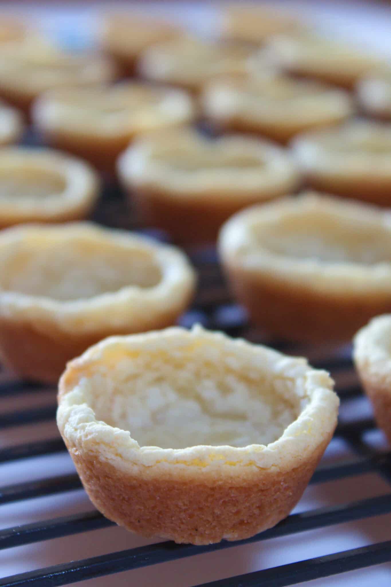 Coconut Cream Pie Cookie Cups Recipe featured by top US cookie blog, Practically Homemade