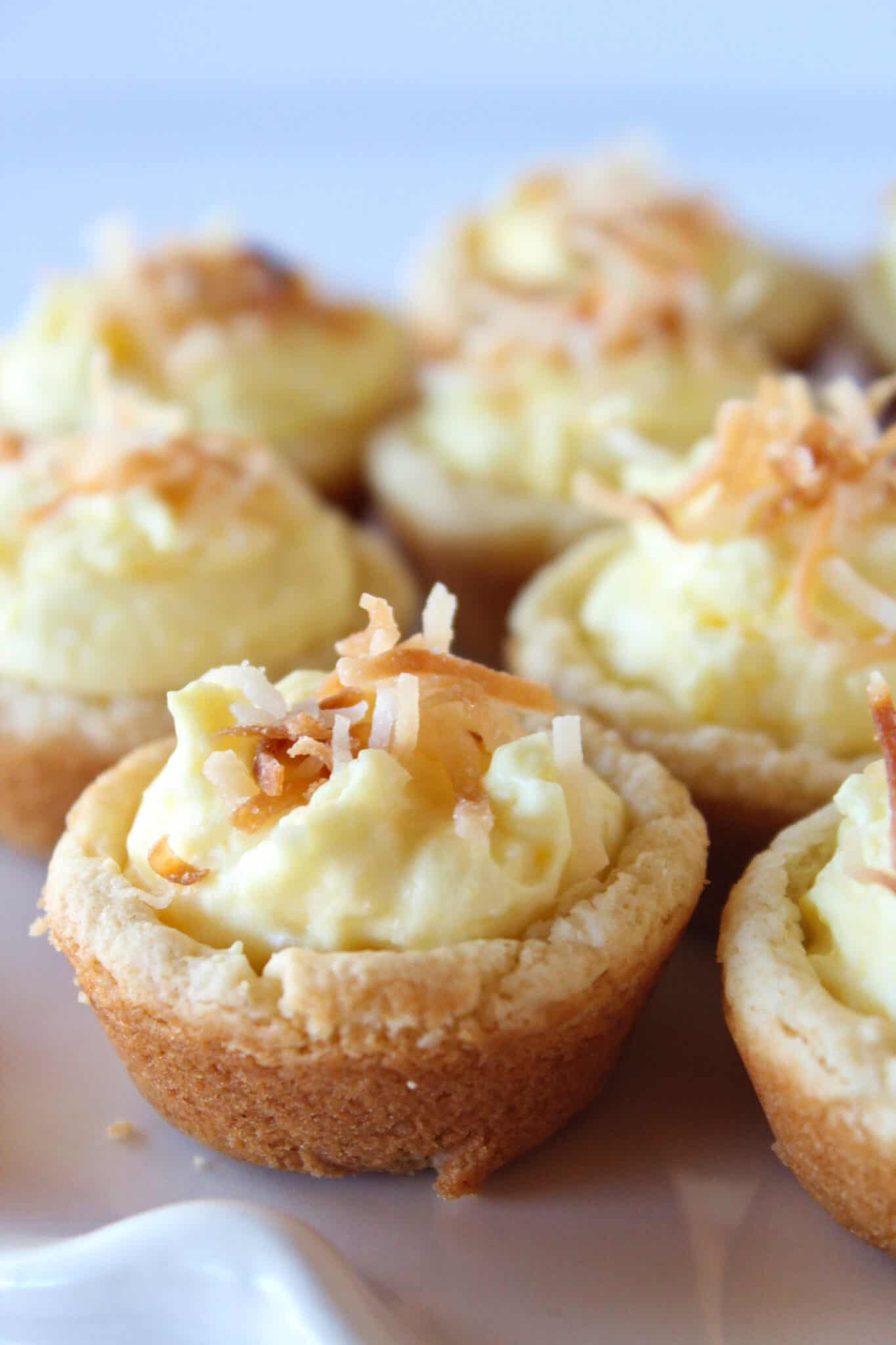Coconut Cream Pie Cookie Cups Recipe featured by top US cookie blog, Practically Homemade