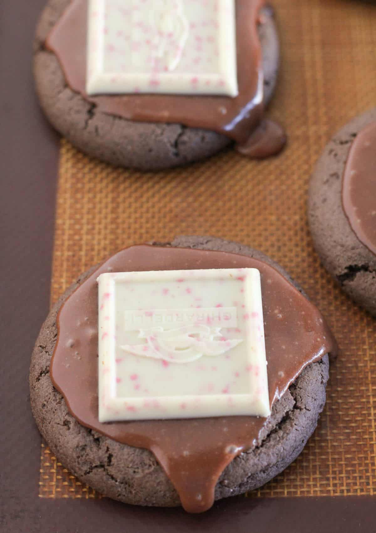 Chocolate peppermint cookies with frosting and peppermint candies.