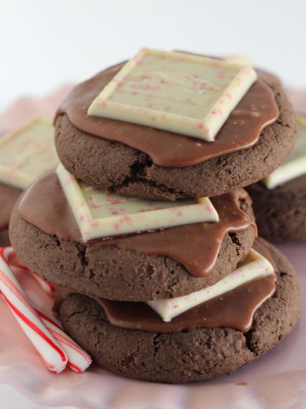 Chocolate peppermint cookies on a pink cake plate.