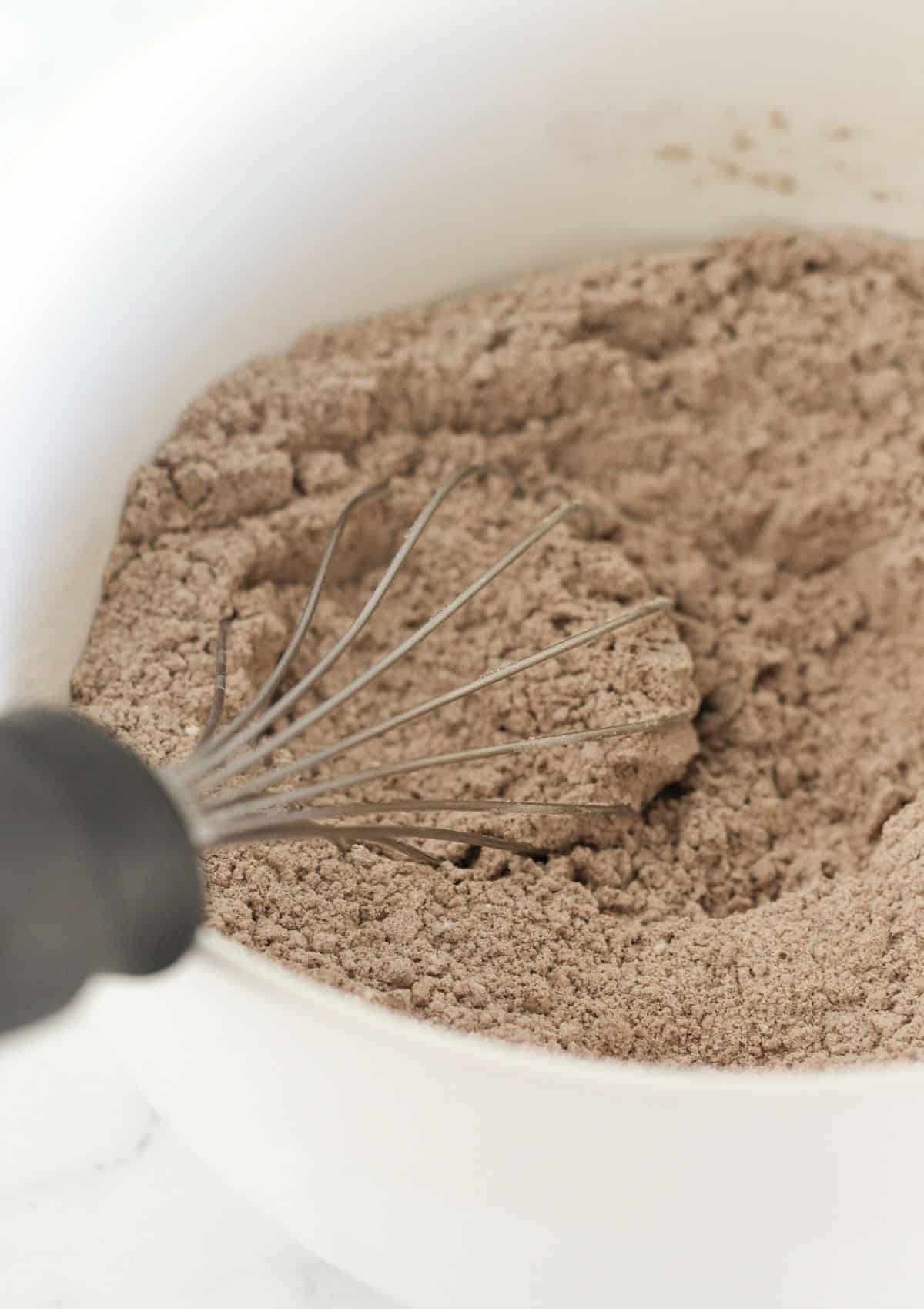 Whisking the dry ingredients in a bowl.