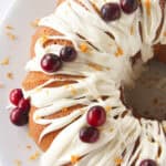 Looking at the top of a cranberry orange bundt cake with frosting.