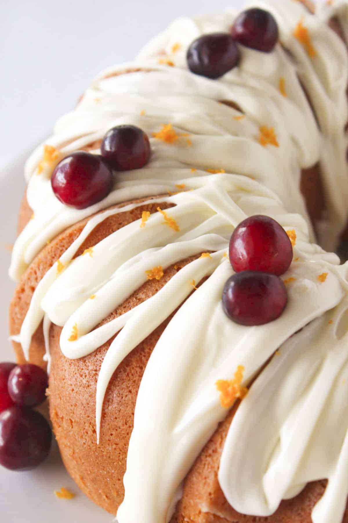 Getting ready to slice the cranberry orange cake made in a bundt pan.