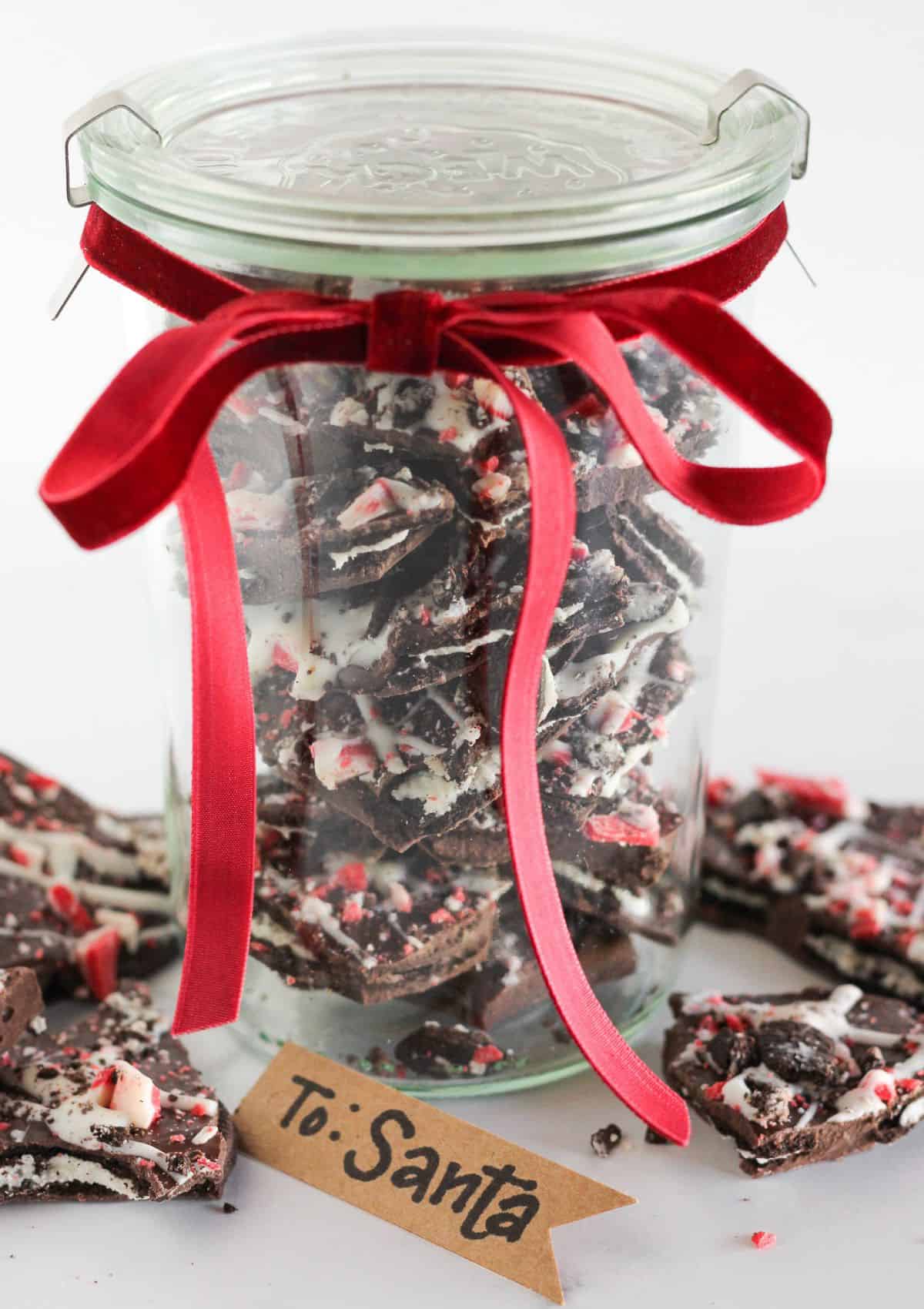 Oreo peppermint bark in a jar and ready to gift.