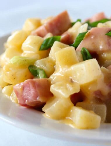 Easy Crock Pot Potatoes and Ham Recipe featured by top US food blog, Practically Homemade
