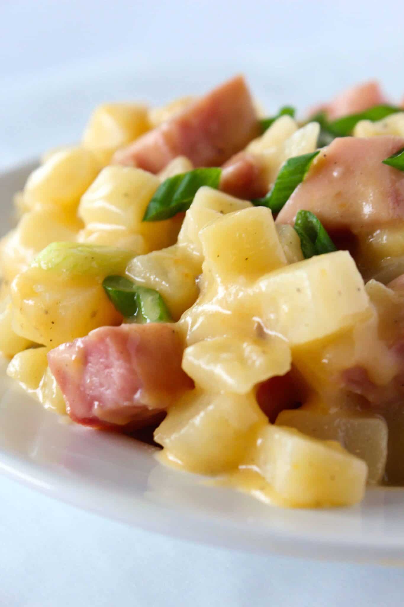 Easy Crock Pot Potatoes and Ham Recipe featured by top US food blog, Practically Homemade