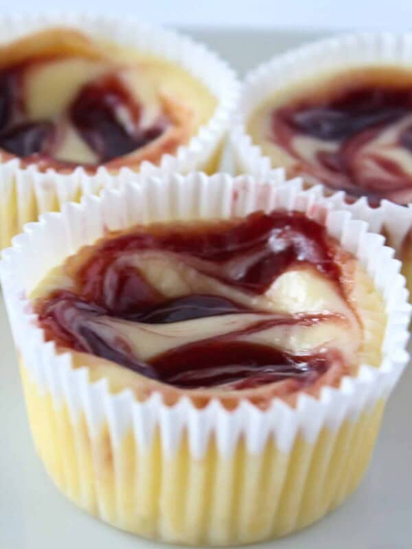 Dessert Cup Ideas: Mini Raspberry Cheesecakes featured by top US dessert blog, Practically Homemade.