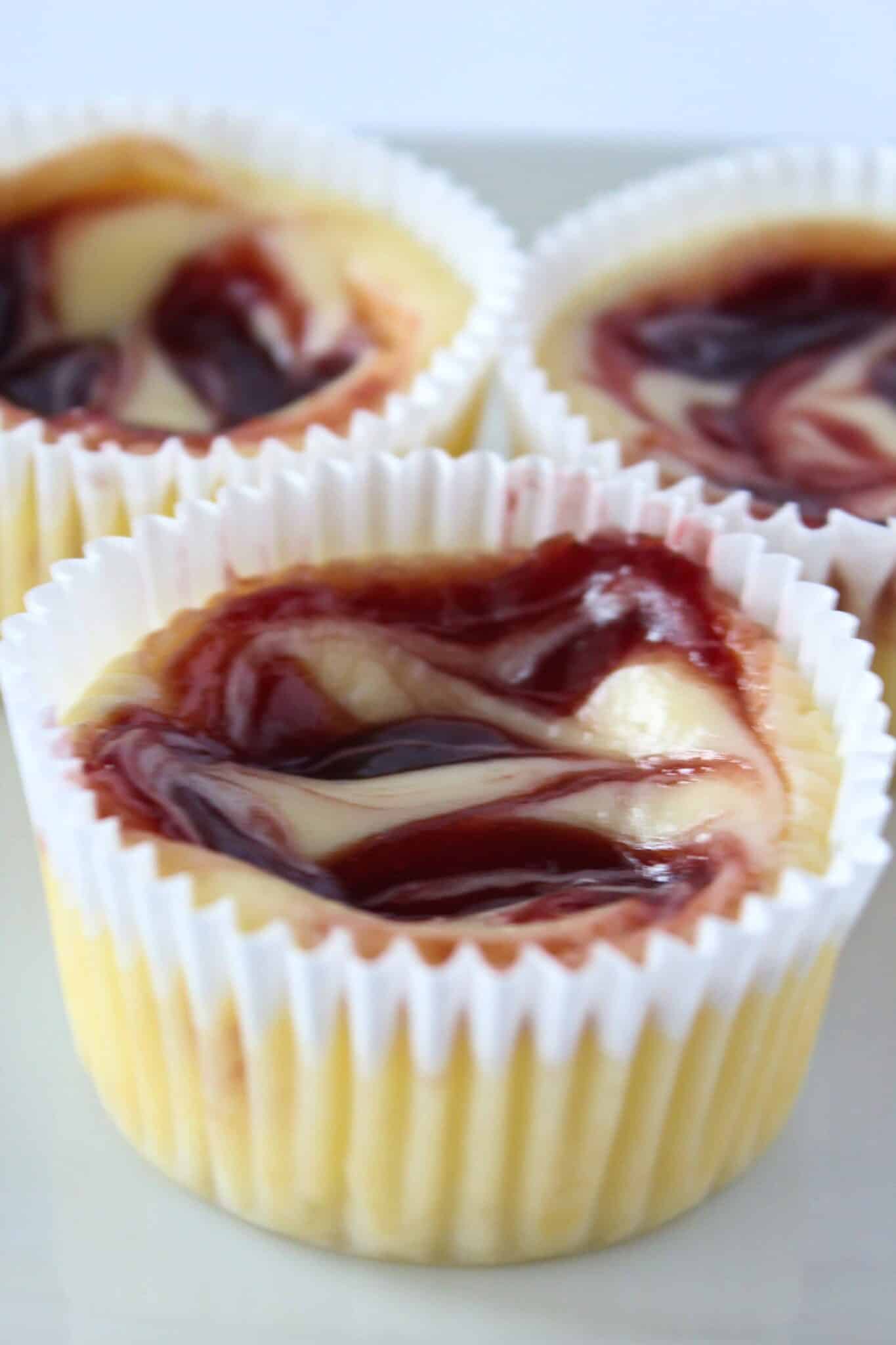 Dessert Cup Ideas: Mini Raspberry Cheesecakes featured by top US dessert blog, Practically Homemade.