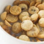 A bowl of homemade cookie crisp cereal with milk.