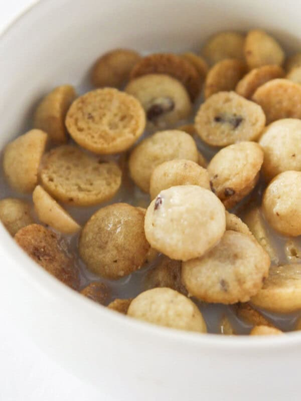 A bowl of homemade cookie crisp cereal with milk.