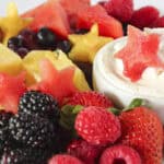 A 4th of July fruit platter with cheesecake dip.