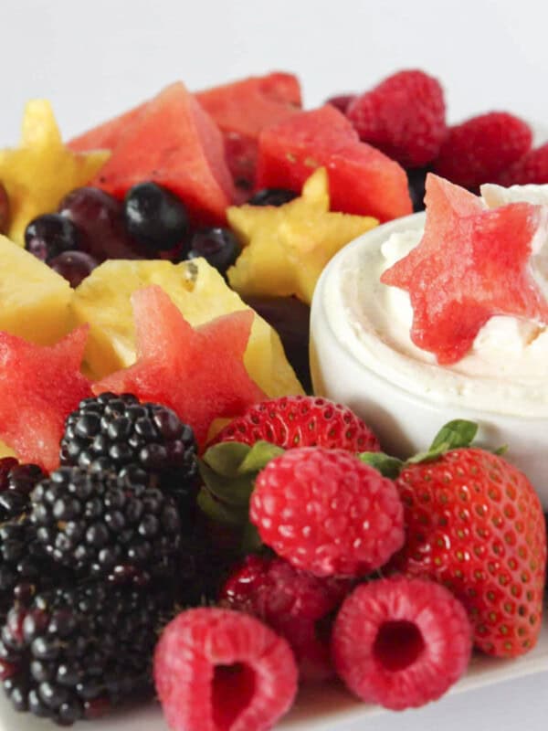 A 4th of July fruit platter with cheesecake dip.