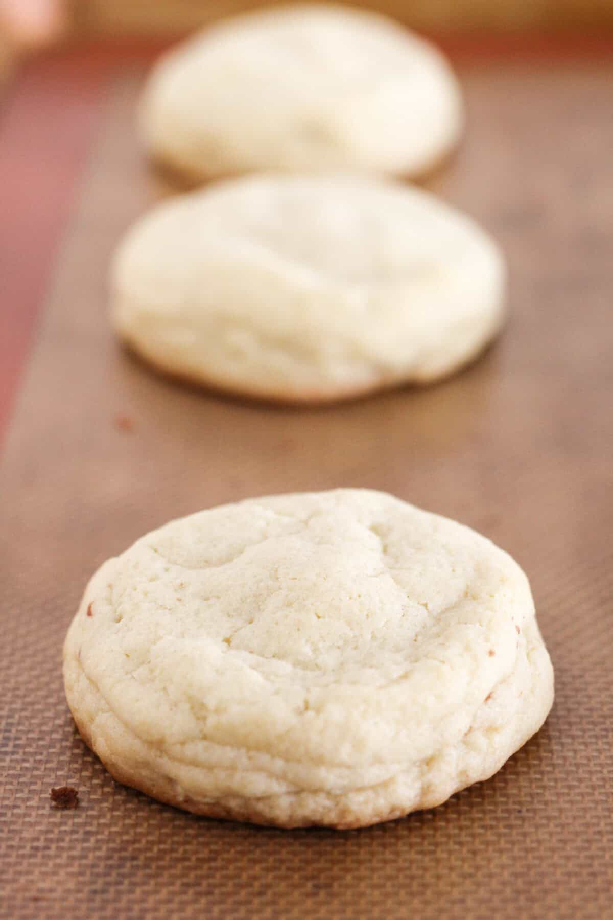 Baked Reese's Peanut Butter Cup Stuffed Cookies on baking sheet.