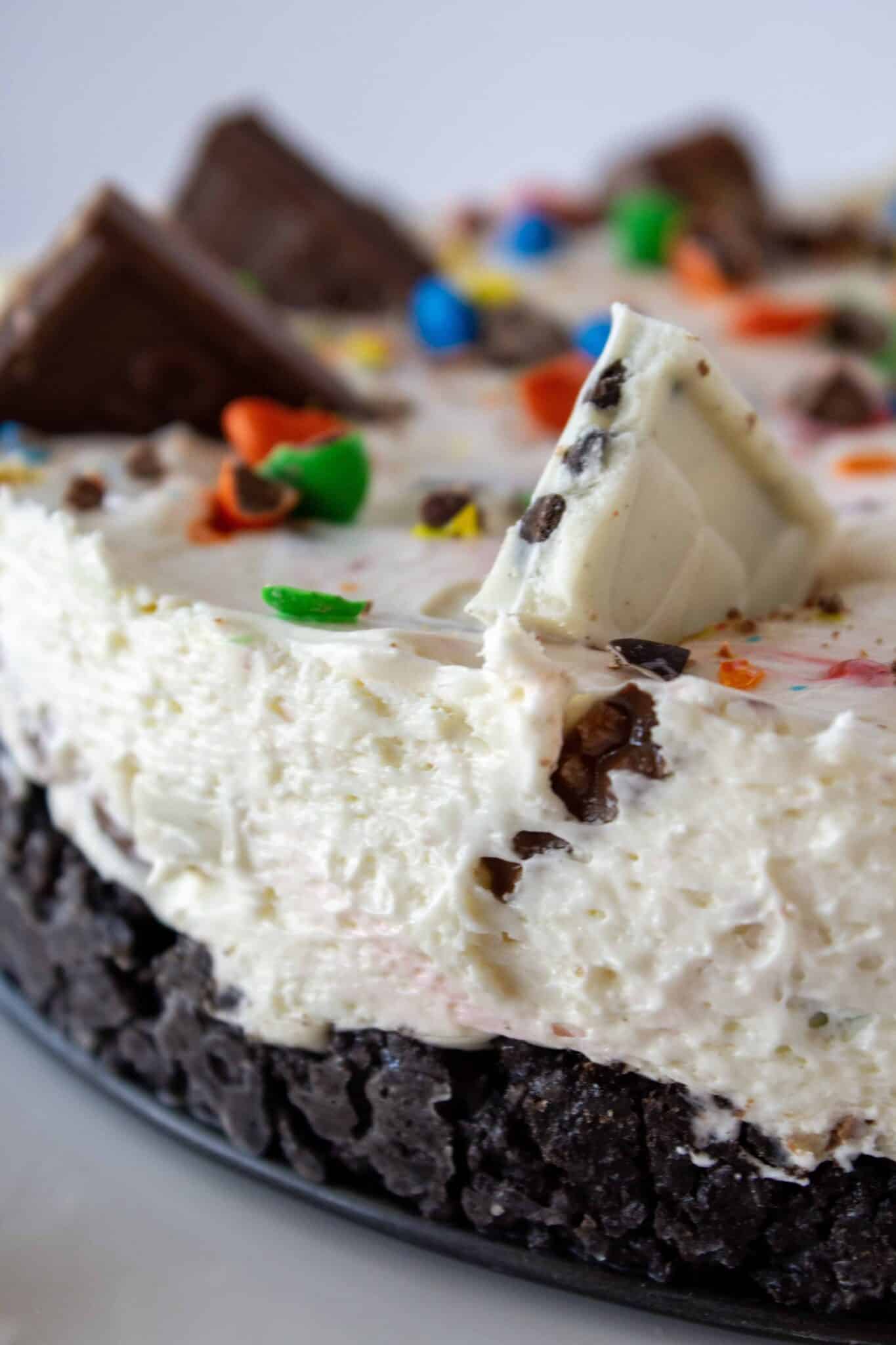 No Bake Halloween Candy Cheesecake Recipe featured by top US dessert blogger, Practically Homemade