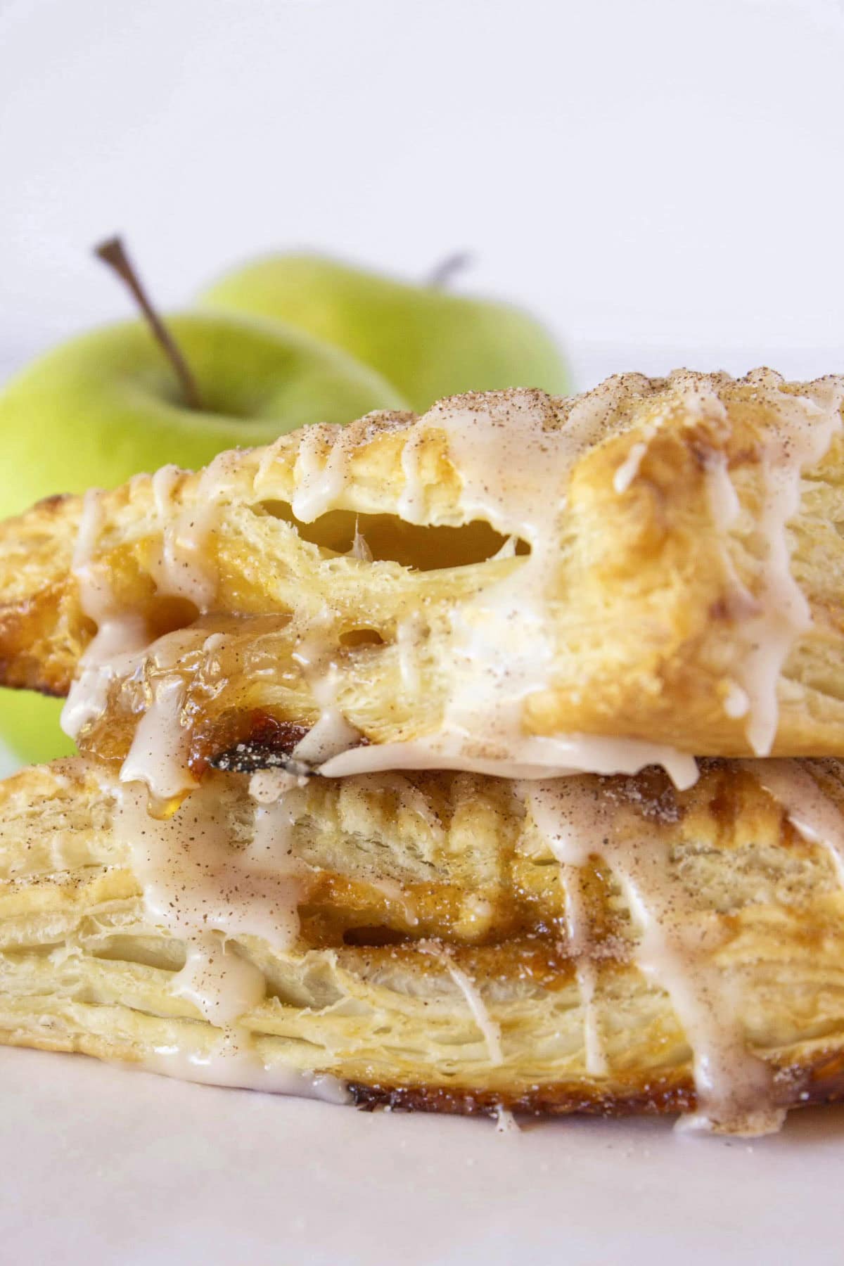 Two caramel apple turnovers stacked on each other.