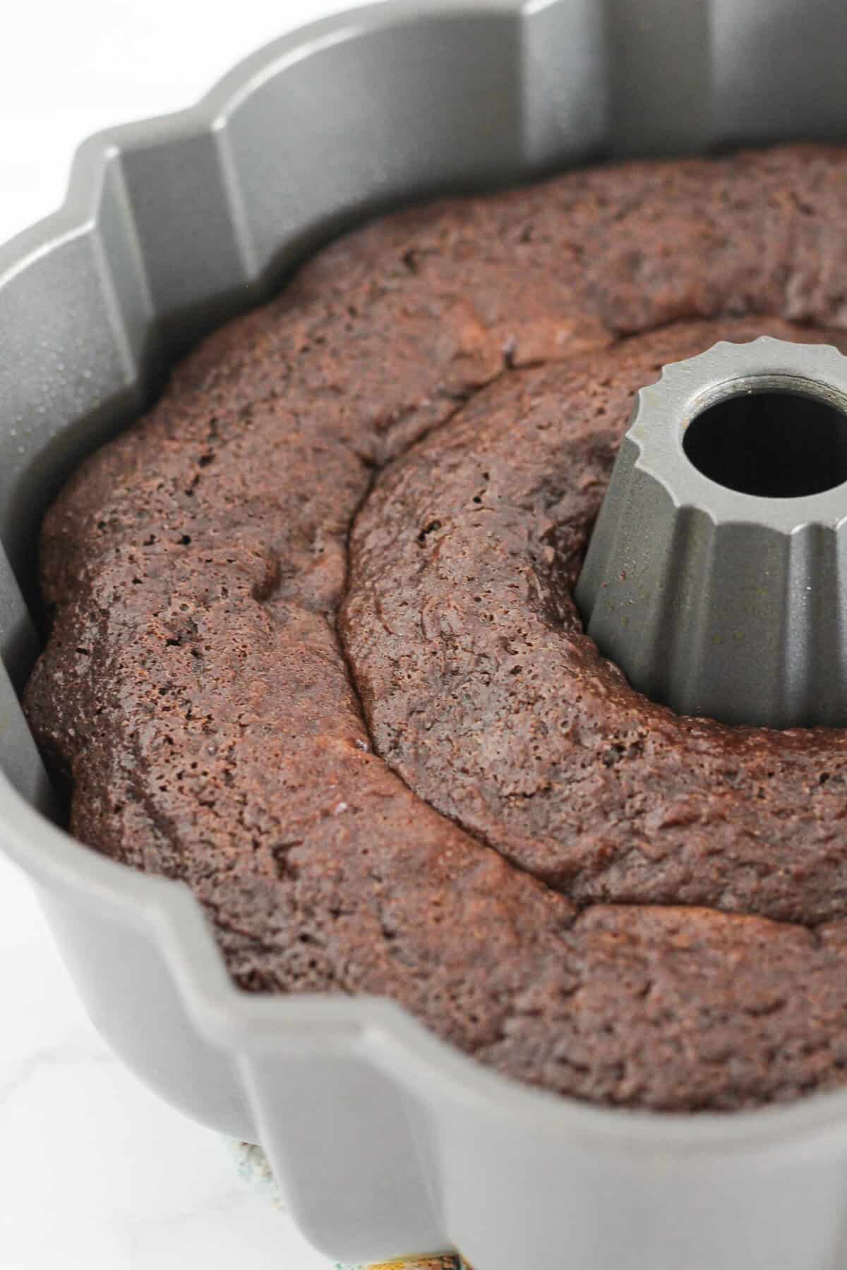 A baked Texas Bundt Cake in the pan cooling.
